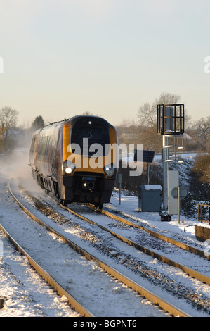 Arriva Cross-Country Voyager train at speed in snow, Warwickshire, UK Stock Photo