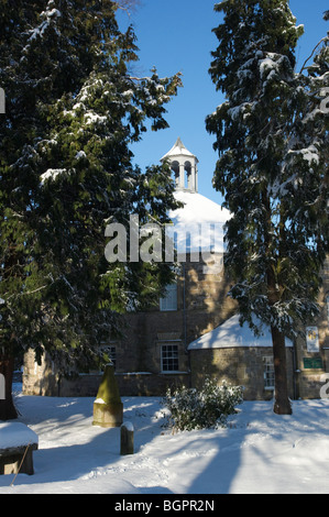 Winter January 2010 Scotland - Kelso Scottish Borders. Old Parish Church with evergreen trees in snow. Stock Photo