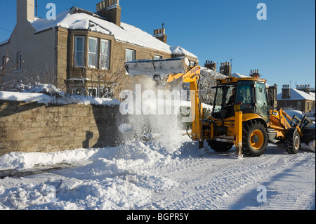 Winter January 2010 Scotland - Kelso Scottish Borders. JCB clearing snow from side road. Stock Photo