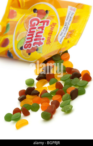 Bag of Rowntrees Fruit Gums spilling onto a white surface Stock Photo
