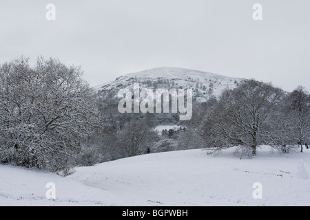 White snow covered landscape showing North Hill from Malvern Common, Malvern Hills, Worcestershire. Stock Photo