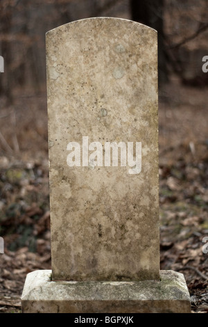 Blank weathered tombstone. Includes clipping path for the tombstone. Stock Photo