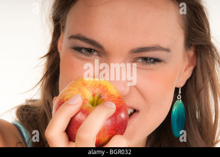 A girl eating an apple Stock Photo
