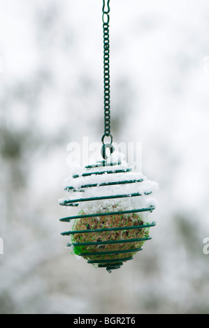 Fat ball bird feeder covered in snow Stock Photo