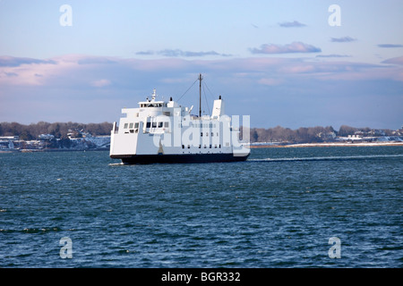 Car and passenger ferry approaches Port Jefferson, Long Island, NY after crossing Long Island Sound from Bridgeport, CT Stock Photo