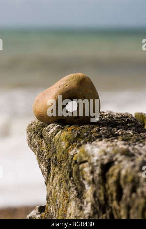 Pebble with Hole In Middle Stock Photo