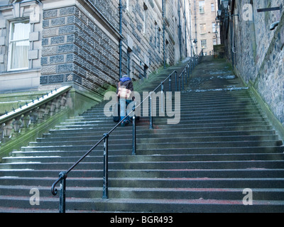 Man Ascending Flight of Stone Steps, Edinburgh Stock Photo