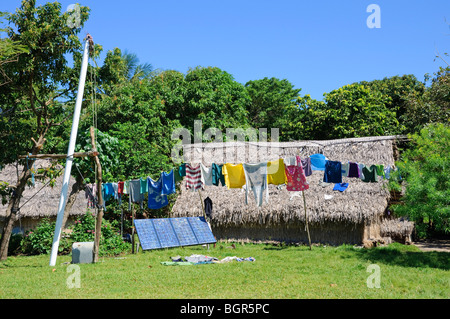 Solar panels power traditional homes in a remote, isolated village Stock Photo