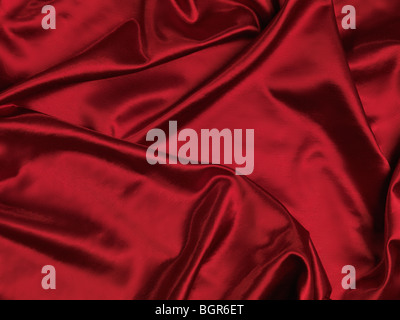Red shiny silky fabric background Stock Photo
