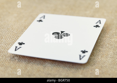 The ace of spades lies on a table covered with a fabric Stock Photo