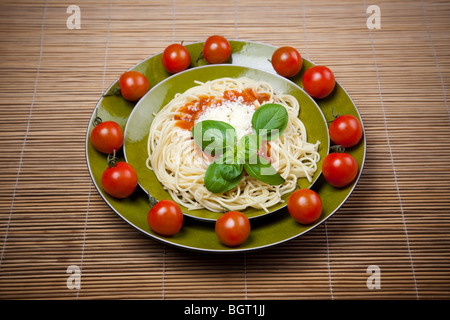 Spaghetti, tomato, cheese and basil Stock Photo
