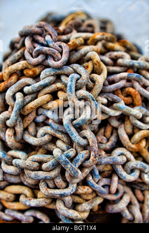 HDR photograph of a pile of old textured and rusty chains, macro shot with a narrow depth of field. Stock Photo