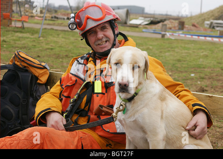 USAR fire-fighter with Rescue dog Stock Photo - Alamy