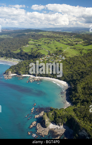 Ohope Beach (left) and Otarawairere Bay, near Whakatane, Bay of Plenty, North Island, New Zealand - aerial Stock Photo