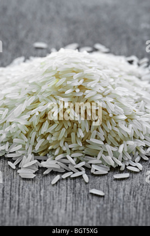 Pile of raw long grain white rice grains Stock Photo