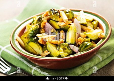 Vegetarian bowl of roasted brussels sprouts with walnuts Stock Photo