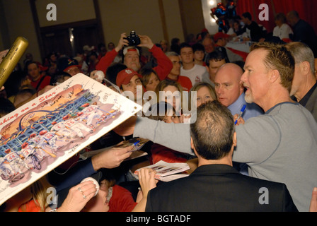 Fans mob Mark McGwire for his autograph, after apology speech for steroid use. Stock Photo