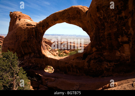 Double O Arch in the Devils Garden section of Arches National Park, Utah, USA Stock Photo