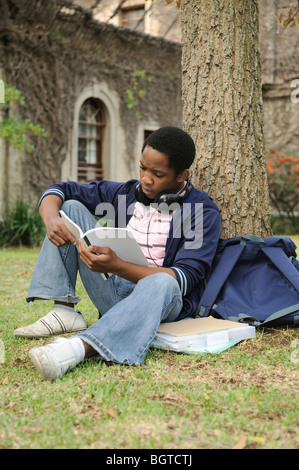 Student with files on university campus, Cape Town, Western Cape , South Africa Stock Photo