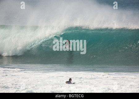 A surfer inside the barrel at Pipeline, North Shore, Oahu, Hawaii Stock Photo