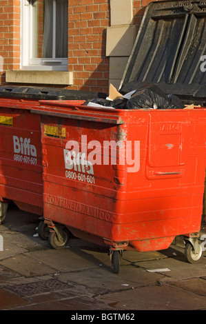 Row of red Biffa large commercial waste wheelie bin bins York North Yorkshire England UK United Kingdom GB Great Britain Stock Photo