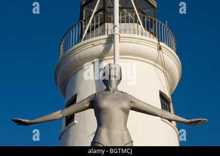 Close up of figure of the Diving Belle next to Scarborough Lighthouse North Yorkshire England UK United Kingdom GB Great Britain Stock Photo