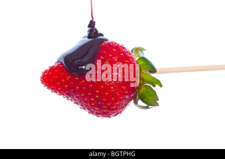 Strawberry dipped in chocolate. Isolated on white Stock Photo