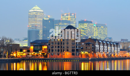 Night view of Greenland Dock with Canary Wharf in the background, Surrey Quays, Rotherhithe, East London, SE16, United Kingdom Stock Photo