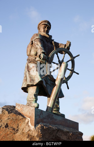 Statue of Coxswain Richard (Dic) Evans outside Moelfre RNLI Seawatch Visitor Centre. Moelfre, Anglesey, North Wales, UK Stock Photo