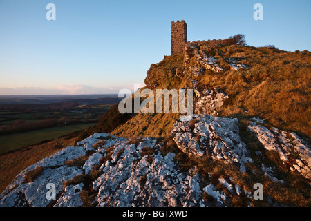 Brent Tor Church lit by the last rays of winter sunshine, Dartmoor, Devon. Stock Photo