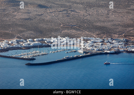La Graciosa Island with the harbour and town of Caleta del Sebo, view from the Mirador del Rio, Lanzarote, Canary Islands, Spai Stock Photo