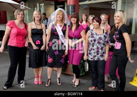 A group of women on a hen weekend in central London. All dressed up in pink. Stock Photo