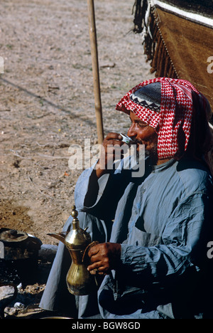 Kuwaiti Bedouin enjoying a cup of real Arabian coffee. Stock Photo