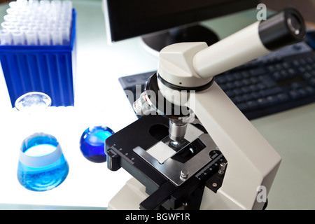Microscope, Computer and Scientific Research Equipment In Laboratory Stock Photo