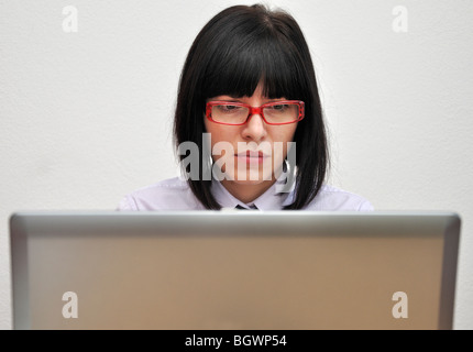 Young businesswoman using laptop Stock Photo