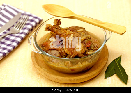 Baked duck with apples pine nuts and raisins. Recipe available. Stock Photo