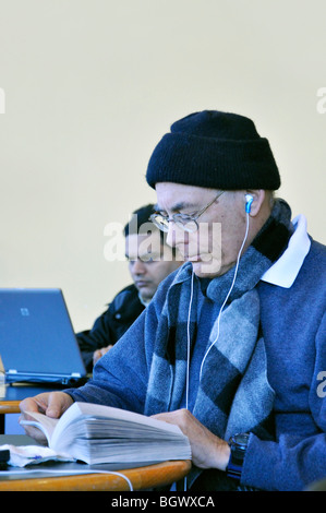 Man in cafe reading book Stock Photo