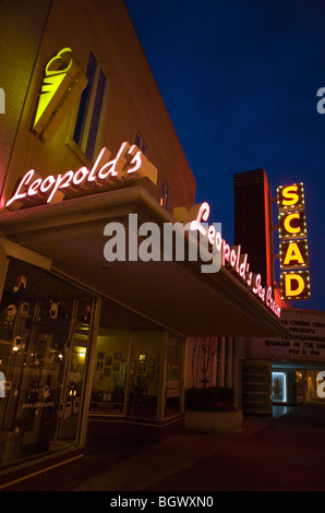 Store signs for Leopold's Ice Cream and SCAD Theatre at night, Savannah, Georgia, United States of America. Stock Photo