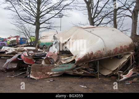 caravan caravans smashed up old vans camping camper campervans camp site sites campsite campsite rubbish bad tip tips pit pits c Stock Photo