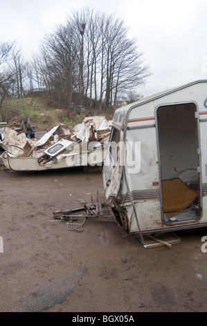 caravan caravans smashed up old vans camping camper campervans camp site sites campsite campsite rubbish bad tip tips pit pits c Stock Photo