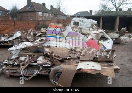 caravan caravans smashed up old vans camping camper campervans camp site sites campsite campsite rubbish bad tip tips pit pits c Stock Photo