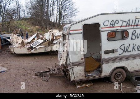 caravan caravans smashed up old vans camping camper campervans camp site sites campsite campsite rubbish bad tip tips pit pits c Stock Photo