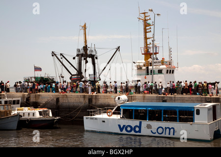 Crowd of people waiting to catch the ferry in Maputo, Mozambique Stock Photo