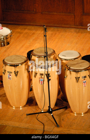 A set of conga drums, set up on a stage. Stock Photo