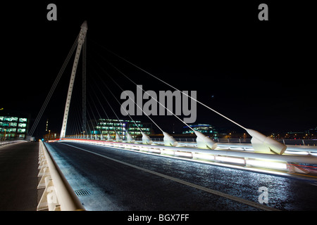 Samuel Beckett Bridge over the Liffey River at night, in Dublin, Ireland. Stock Photo