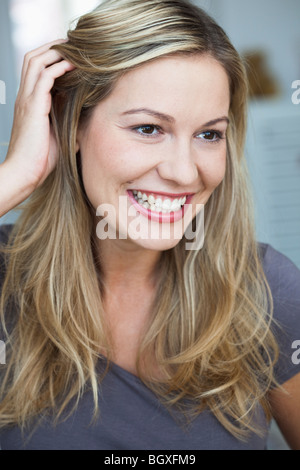 Young woman smiling feeling flattered Stock Photo