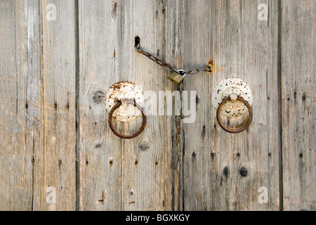 Old wooden doors with antique door furniture Stock Photo