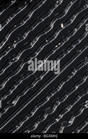 The grooves on a 45RPM stereo single vinyl record photographed at 25x resolution Stock Photo