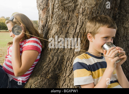 Kids with Tin Can Phones Stock Photo