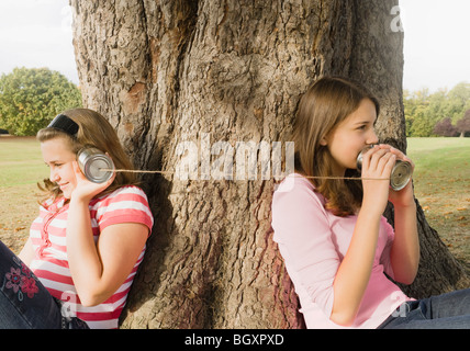 Kids with Tin Can Phones Stock Photo